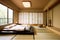 japanesestyle bedroom, with minimalist furnishings and natural textures