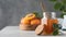 A jar with apricot jam and a spoon close-up on a gray. Fruit preservation. Copy space