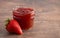 Jar of Classic Strawberry Jam on a Rustic Wooden Table