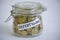 Jar with coins saying Abfertigung financial compensation