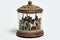 A jar containing a tiny, working carousel with horses and music