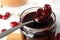 Jar of delicious pickled cherries, closeup