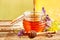 Jar of fresh honey with assorted wildflowers