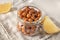 Jar with fried chickpeas on table