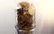 Jar full of bitcoins. Good habits in storing cryptocurrencies concept. Realistic 3D rendering