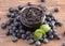 Jar of Homemade Blueberry Jam on a Rustic Wooden Table