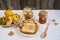 Jar of homemade jam with tea, sandwich and quinces