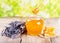 Jar of honey with honeycomb and lavander flowers