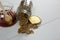 Jar of honey and wheat flakes spilling out of bottle