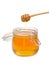 Jar of honey with wooden drizzler