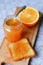 Jar of orange marmalade and toast with orange