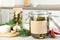 Jar of pickled cucumbers with blank sticker on grey table in kitchen