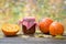 Jar of pumpkin jam, puree or sauce and small ripe pumpkins