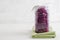 Jar with purple sauerkraut standing on napkin