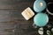 Jar with scrub and spa supplies on wooden background