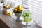 Jar of tasty fresh lemonade with ice and mint. Lemons on background.