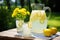 A jar and two glasses of refreshing lemonade, captured at noon.