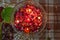 A jar is which is loaded with rose and candle on indian festival diwali deepawali with fire  on table