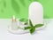 Jar, white glass bottle with pipette and mint leaves, container for aromatic oils and cosmetics