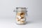 Jar with white sugar cubes and brown cane sugar lump on white background