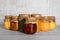 Jars with canned fruit jams on wooden table