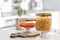 Jars with foodstuff on wooden table in kitchen