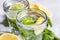 Jars of fresh mojito on table, closeup