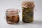 Jars of Homemade pickled vegetables: cucumbers, pickled honey agarics mushrooms.