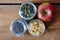 Jars with muesli and an red organic apple