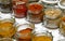 Jars with oriental spices such as curry pepper piucante paprika