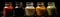 Jars Of Salad Dressingon Black Background Wde Panoramic. Generative AI