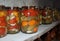 Jars of a variety of pickled vegetables . Canned and preserved foods. Preserves