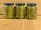 Jars of various pickled vegetables. Canned grape leaves.
