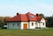 Jaslo, Poland - 9 9 2018: Architectural design of a small, buzzy one-story house with white walls and a red-tiled roof