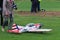 Jaslo, Poland - july 1 2018:A man is a participant with a radio-controlled airplane model on the grassy aerodrome runway. Exhibiti