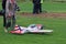 Jaslo, Poland - july 1 2018:A man is a participant with a radio-controlled airplane model on the grassy aerodrome runway. Exhibiti