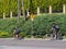 Jaslo/Yaslo, Poland - may 22,2018: Road sign danger on the highway. safety of traffic. Two guys riding bicycles in summer`s sunny