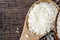 Jasmine rice in wood ladle on old wood texture background, Copy space