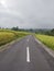 Jatiluwih 25 June 2023 : Road in rice field with cloudy sky, Bali island, Indonesia