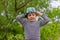 Jaunty macho little boy in a colorful trendy hat