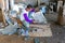 JAVA, INDONESIA - DECEMBER 21, 2016: Worker making kitchen utensils in a factory on Java Indonesia 21th december 2016.