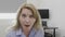 Jaw dropped office woman with wide opened mouth in full disbelief having shocking reaction -