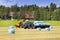 JCB Reach Forklift Stacking Bales onto Trailer