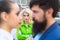 Really jealous of him. Jealous woman look at couple in love on street. Romantic couple of man and woman dating. Bearded