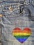 Jean with a rainbow heart sewed in it