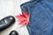 Jeans skirt, black shoes and red maple leaf, collage. Fashionable concept. Close up