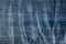 Jeans tissue background texture - wrinkled and discolored
