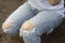 Jeans torn or ripped jeans Asian female leg, focus and close up to the knee