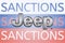 Jeep logo in front of the sanction text on the Russian flag. Fresh sanctions against Russia over its invasion of Ukraine