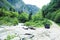 Jeep on road hight in mountain, beautiful summer landscape with river